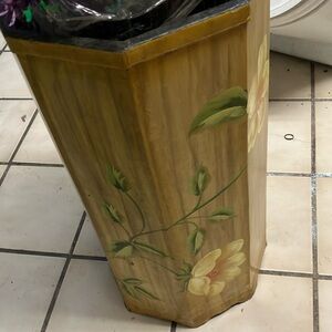 Wooden octagon flower pot with yellow flower pattern.